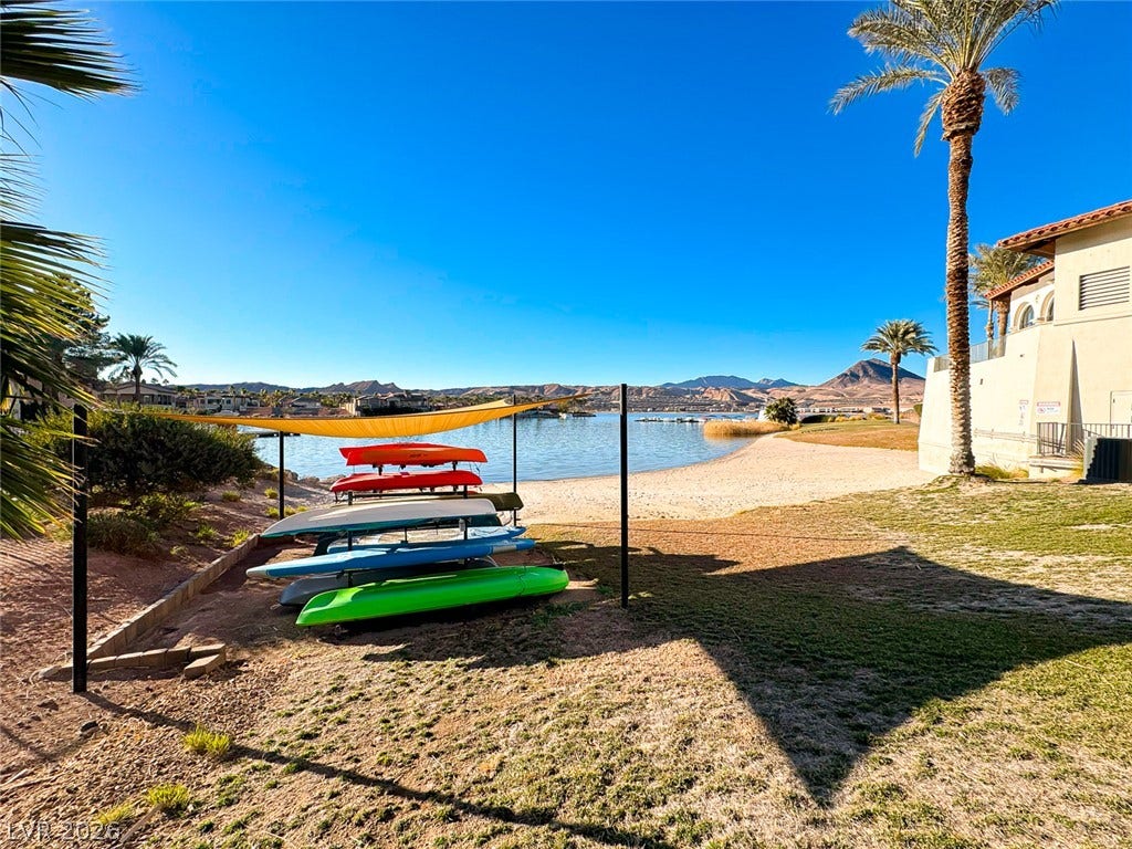 26 Strada Di Circolo, #n/a, Henderson, NV 89011 Scenic water views and sandy shores lie just steps from the property.