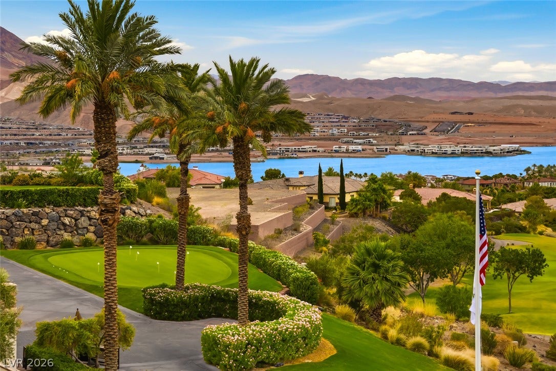 26 Strada Di Circolo, #n/a, Henderson, NV 89011 Lush landscaping frames sweeping views of the water and surrounding desert mountains.