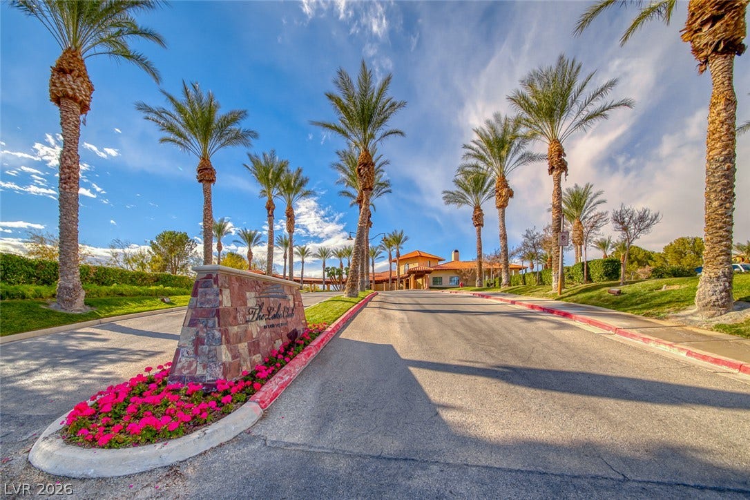 26 Strada Di Circolo, #n/a, Henderson, NV 89011 Soaring palm trees flank the entry drive leading to the Spanish tile roof clubhouse.