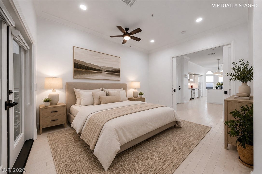 26 Strada Di Circolo, #n/a, Henderson, NV 89011 Crown molding highlights the high ceilings and clean architectural lines of this light-filled bedroom.