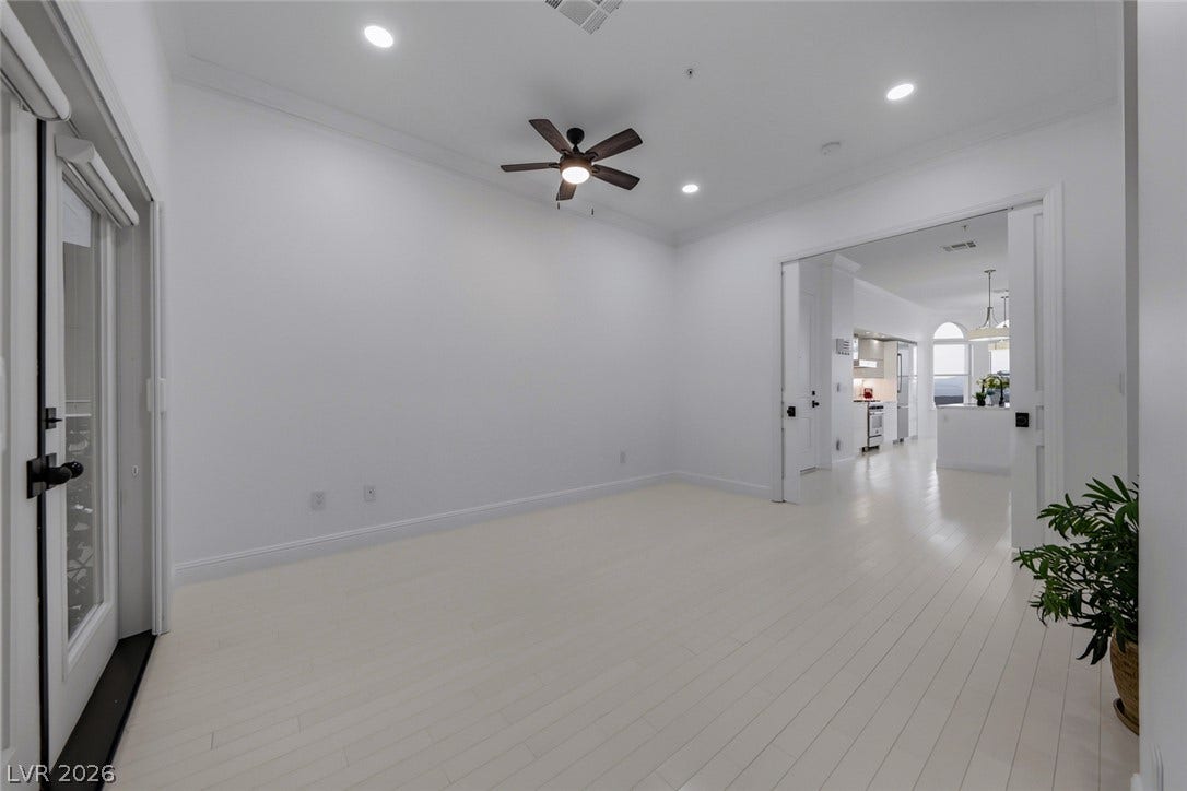 26 Strada Di Circolo, #n/a, Henderson, NV 89011 Gleaming light wood floors and recessed lighting enhance this versatile open-concept living space.