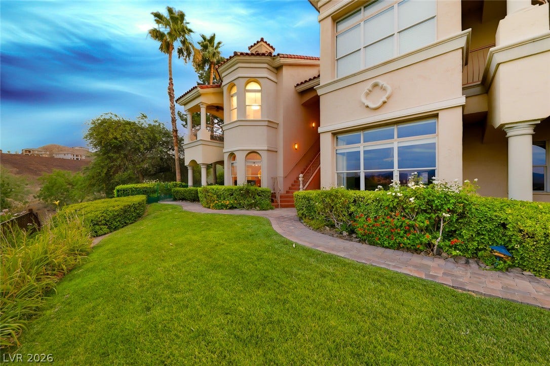 26 Strada Di Circolo, #n/a, Henderson, NV 89011 Lush manicured lawns and stone pathways wind past the stucco exterior of this multi-level home.