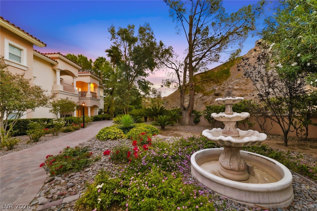 26 Strada Di Circolo, #n/a, Henderson, NV 89011 An elegant tiered stone fountain anchors the beautifully landscaped garden path along this hillside retreat.