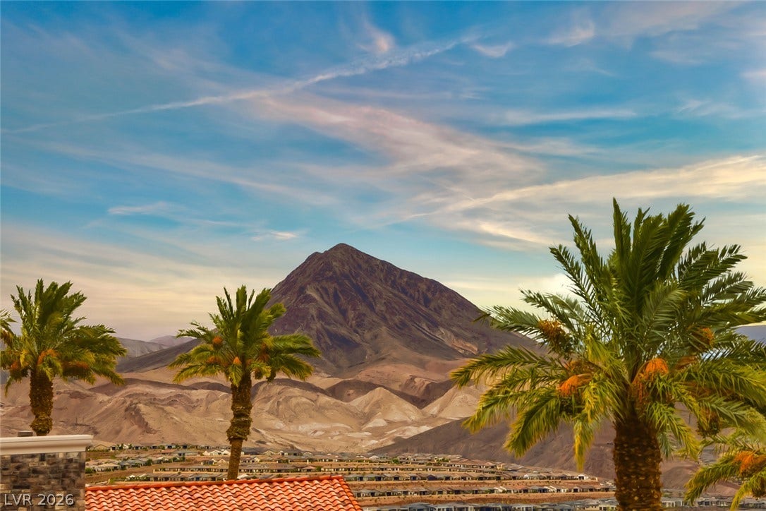 26 Strada Di Circolo, #n/a, Henderson, NV 89011 Panoramic mountain and neighborhood vistas unfold under a dramatic desert sky.