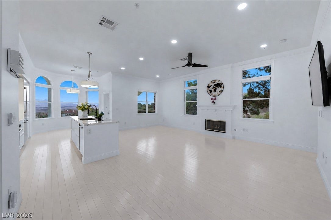 26 Strada Di Circolo, #n/a, Henderson, NV 89011 Gleaming hardwood floors and a sleek fireplace anchor this airy open-concept living space.