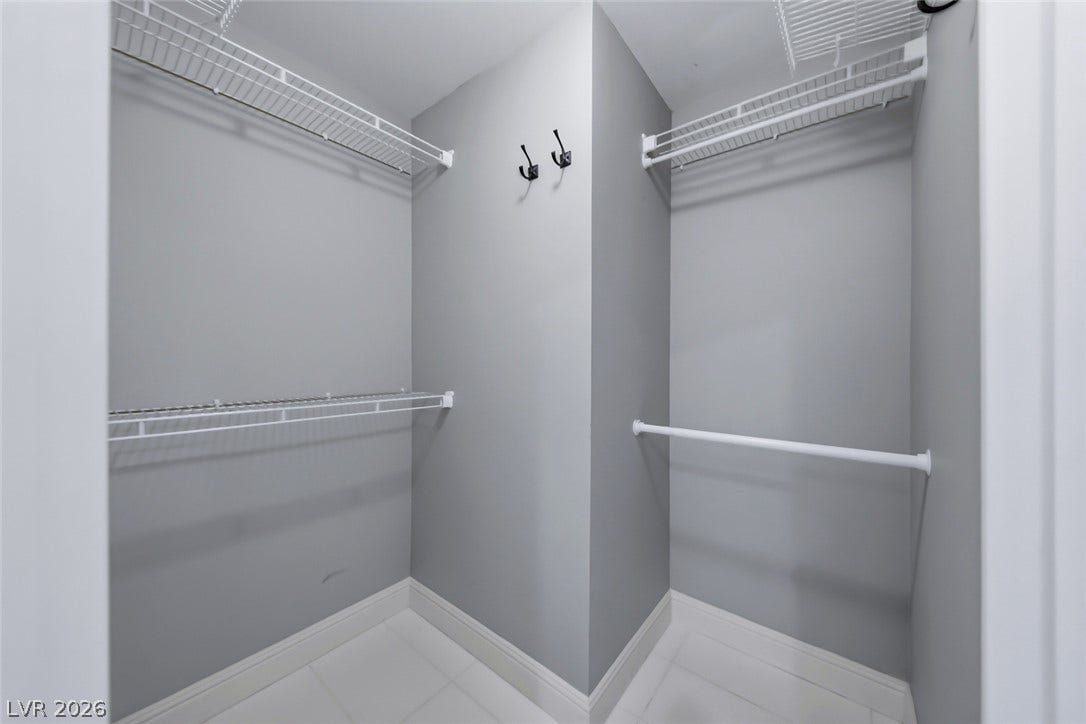 26 Strada Di Circolo, #n/a, Henderson, NV 89011 Ample shelving options maximize organization in this functional walk-in closet space.