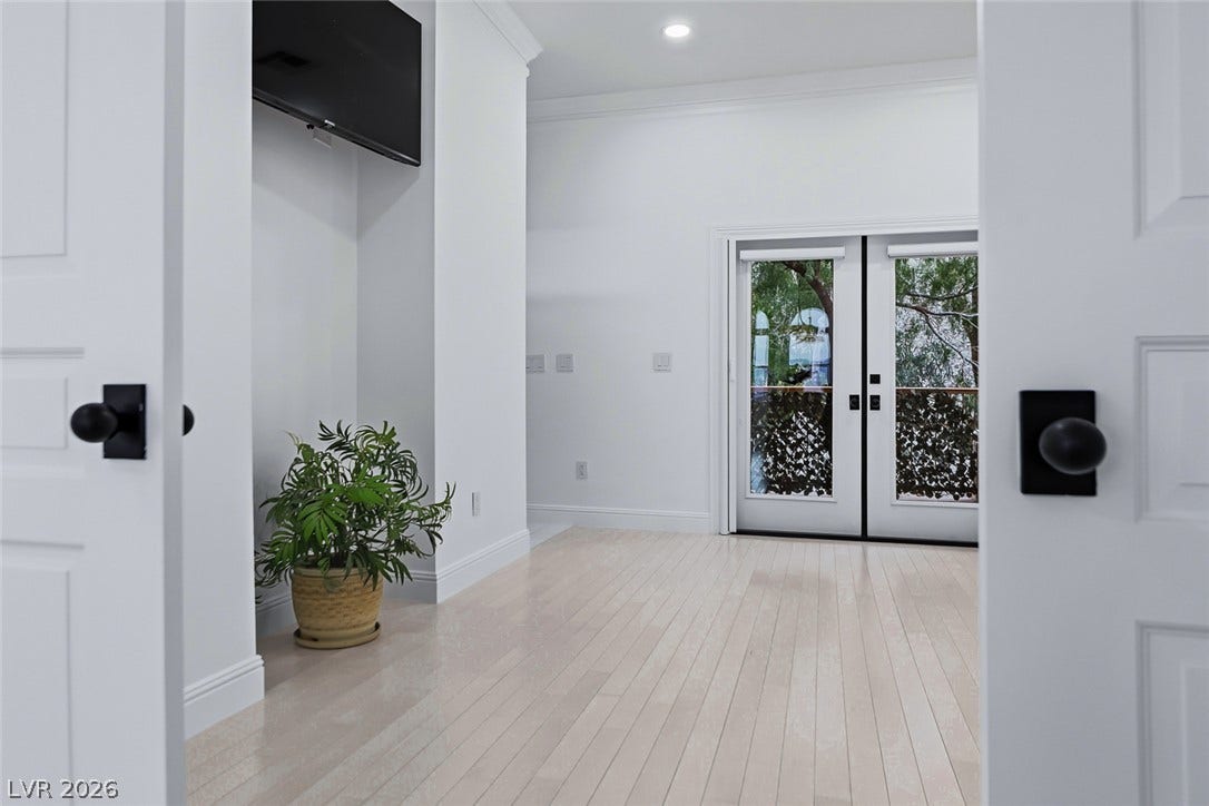 26 Strada Di Circolo, #n/a, Henderson, NV 89011 French doors open to the outdoors from this airy space featuring light wood floors.