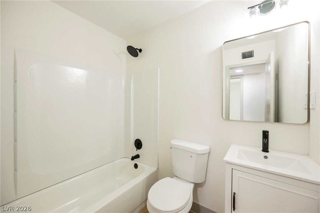 Clean lines and updated fixtures define this functional full bathroom.