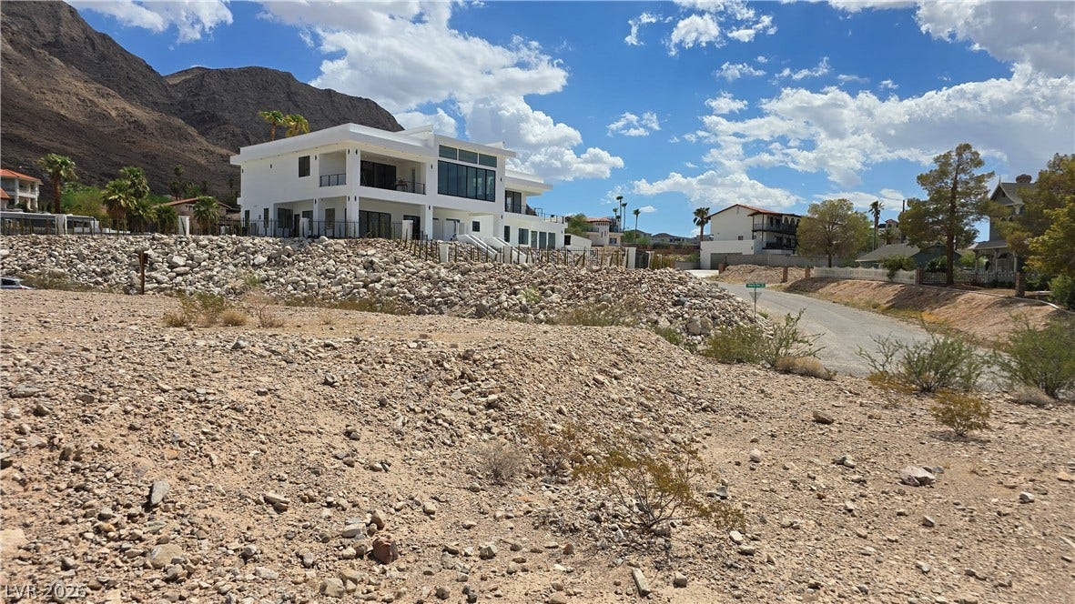 740 Benedict Drive, Las Vegas, NV 89110 Dramatic mountain vistas frame this striking multi-level contemporary estate perched above rugged desert terrain.