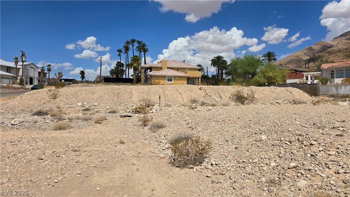 740 Benedict Drive, Las Vegas, NV 89110 Dramatic mountain backdrops frame this undeveloped residential desert lot ready for custom construction.