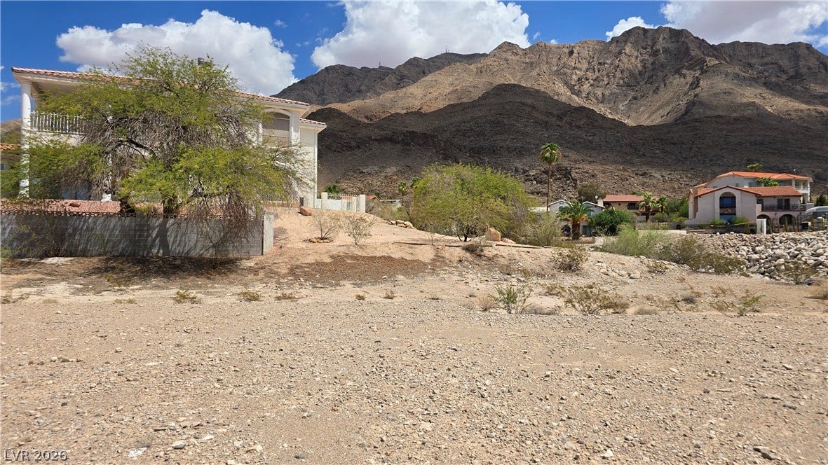 740 Benedict Drive, Las Vegas, NV 89110 Dramatic mountain vistas frame this desert property under blue skies.