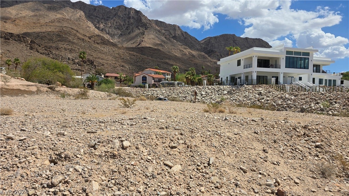 740 Benedict Drive, Las Vegas, NV 89110 Dramatic mountain backdrops frame this modern desert architectural masterpiece situated on an elevated lot.