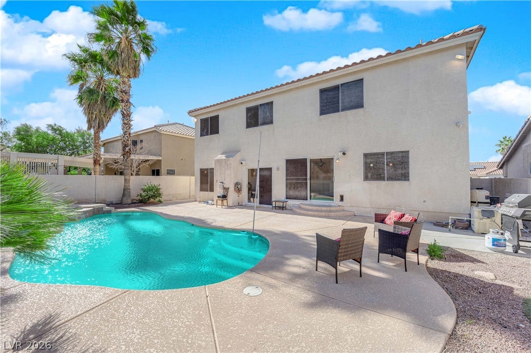 9852 Snowy Canyon Court, Las Vegas, NV 89183 An inviting backyard oasis features a shimmering private swimming pool and spacious concrete patio.