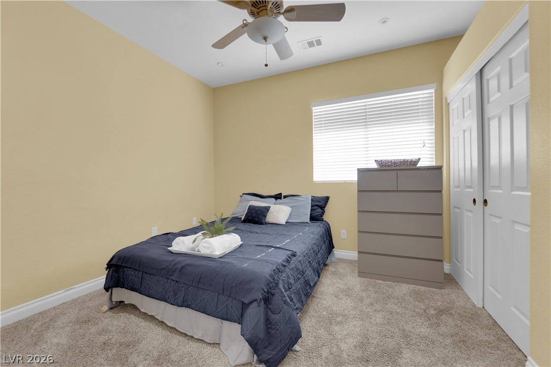 9852 Snowy Canyon Court, Las Vegas, NV 89183 Soft carpeting underfoot and high ceilings enhance the spacious feel of this comfortable bedroom.
