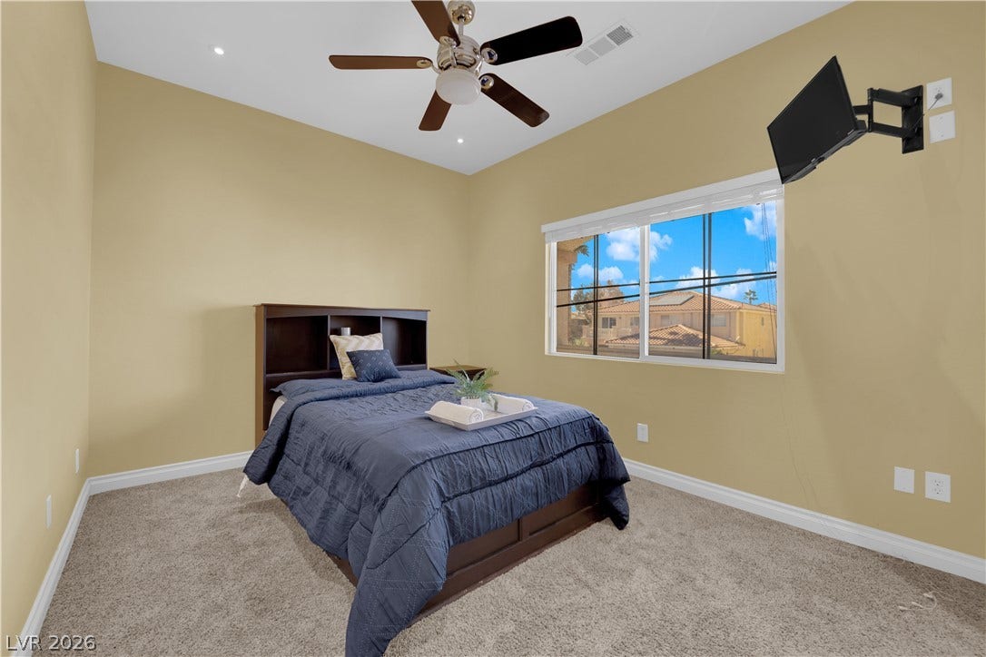 9852 Snowy Canyon Court, Las Vegas, NV 89183 High ceilings and soft carpeting define this inviting bedroom space.
