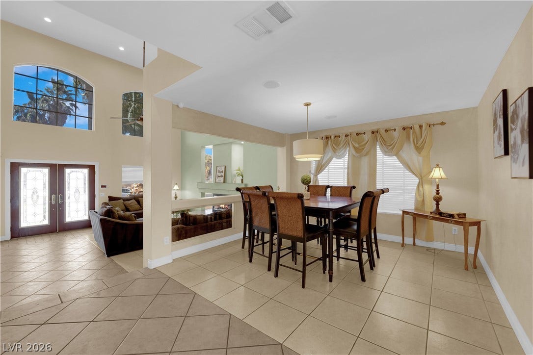 9852 Snowy Canyon Court, Las Vegas, NV 89183 Tiled floors and soaring ceilings create an open, airy ambience throughout the dining area.