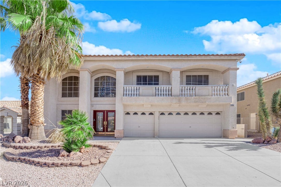 9852 Snowy Canyon Court, Las Vegas, NV 89183 Stately stucco arches and a broad concrete driveway define this commanding two-story exterior design.