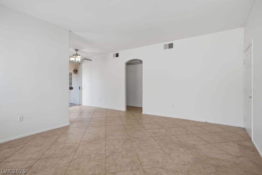 75 N Valle Verde Drive, #311, Henderson, NV 89074 Diagonal tile flooring and smooth white walls define this airy, open-concept interior layout.