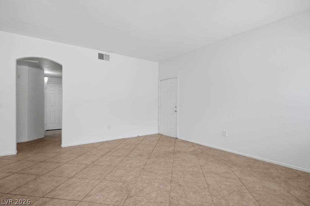 75 N Valle Verde Drive, #311, Henderson, NV 89074 Ceramic tile floors and clean white walls anchor this versatile open living space.