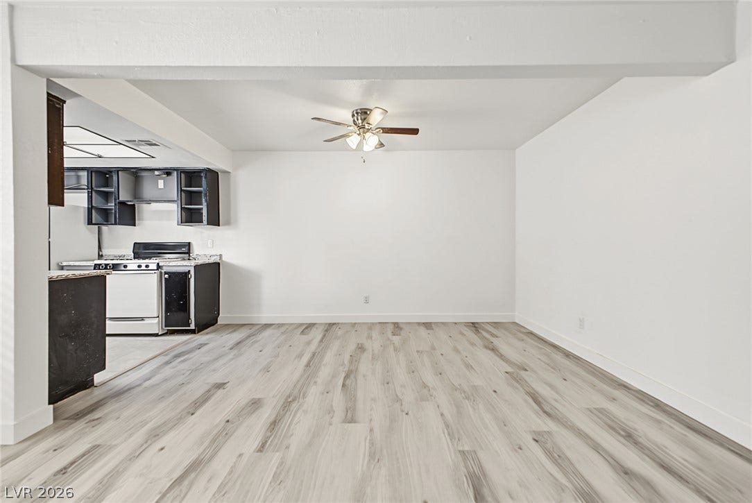 1405 Vegas Valley Drive, #187, Las Vegas, NV 89169 Clean lines and wood-look flooring define this open, versatile living space.