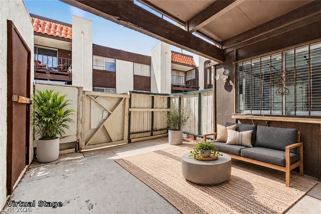 1405 Vegas Valley Drive, #187, Las Vegas, NV 89169 An inviting covered patio offers a private outdoor retreat with concrete flooring and fenced borders.