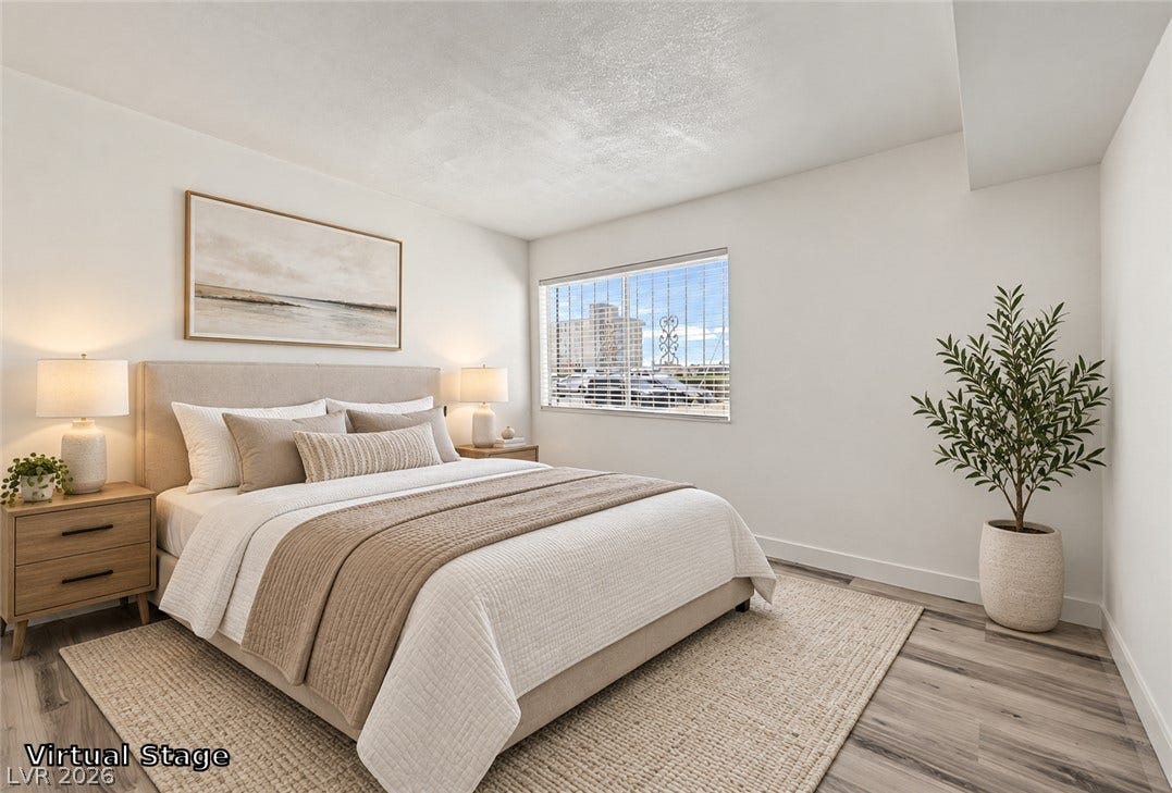 1405 Vegas Valley Drive, #187, Las Vegas, NV 89169 Smooth wood-look flooring and a wide window define this restful sleeping space.