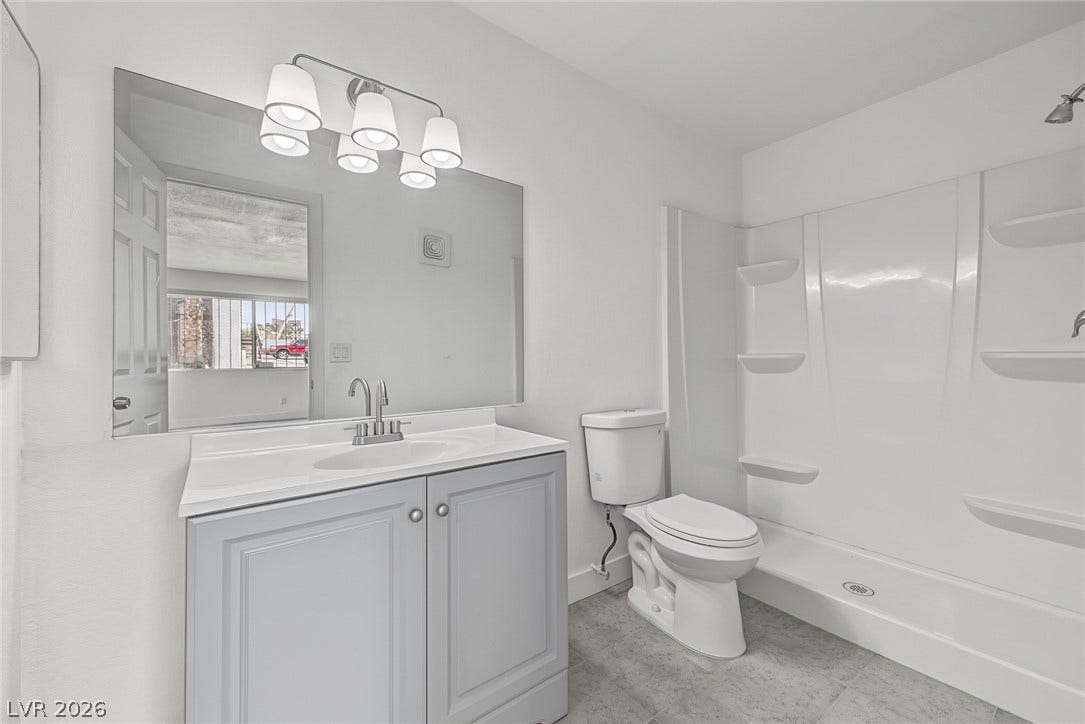 1405 Vegas Valley Drive, #187, Las Vegas, NV 89169 Clean lines and modern surfaces define this updated bathroom featuring a stylish single vanity setup.