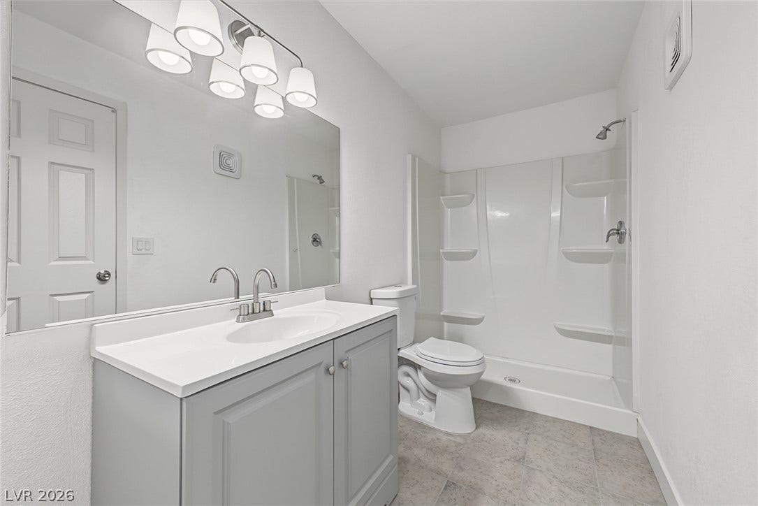 1405 Vegas Valley Drive, #187, Las Vegas, NV 89169 Crisp finishes and a modern vanity highlight this clean, functional bathroom.