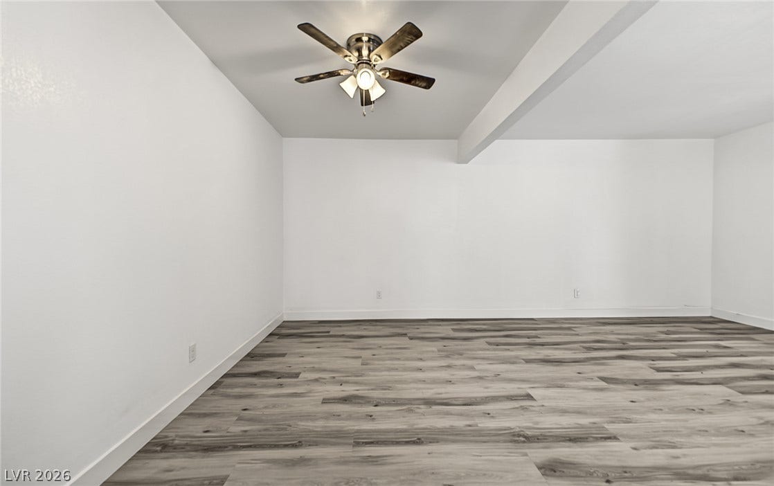 1405 Vegas Valley Drive, #187, Las Vegas, NV 89169 Smooth plaster walls and modern plank flooring define this versatile interior space.