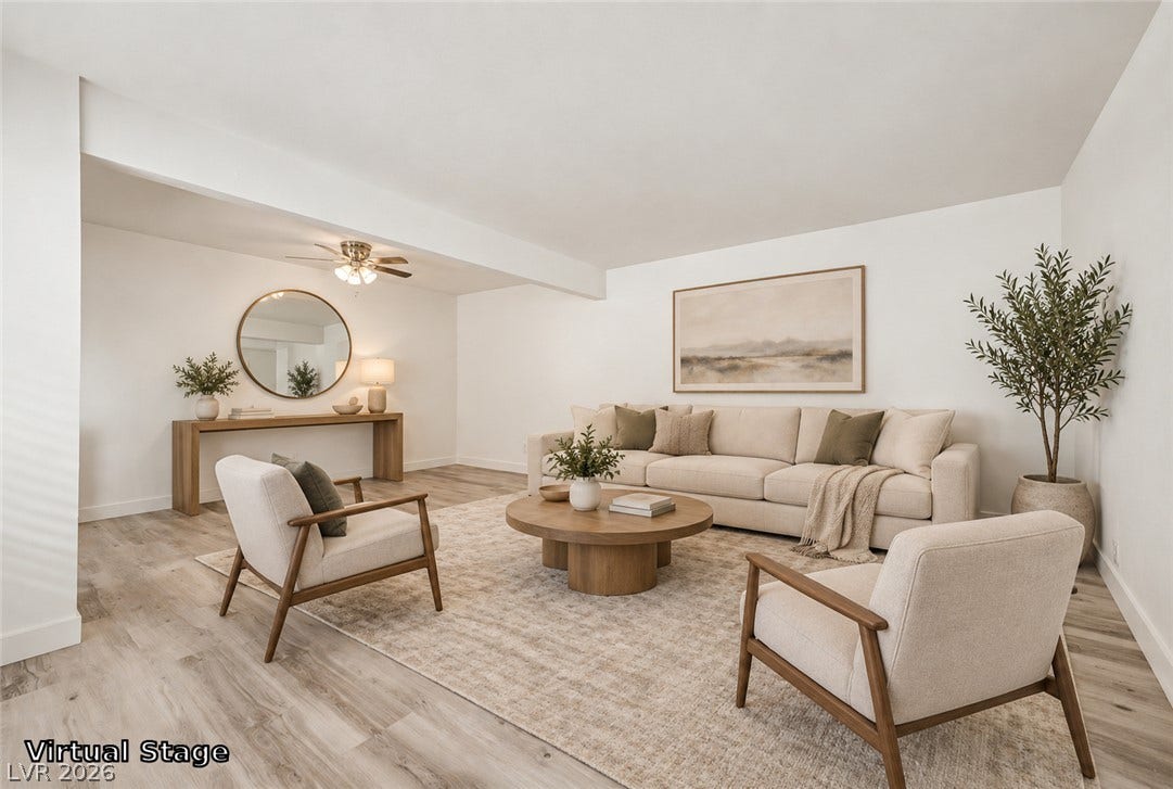 1405 Vegas Valley Drive, #187, Las Vegas, NV 89169 Smooth wood-look flooring and clean white walls anchor this airy living space.