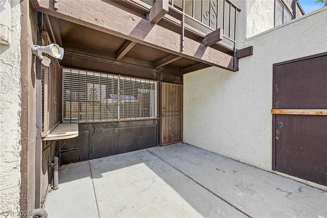 1405 Vegas Valley Drive, #187, Las Vegas, NV 89169 Concrete outdoor surfaces complement the stucco and wood siding exterior walls.