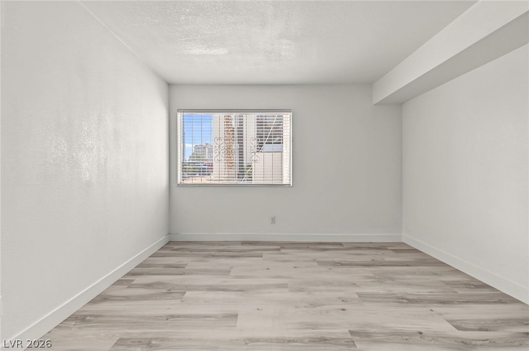 1405 Vegas Valley Drive, #187, Las Vegas, NV 89169 Clean lines and updated plank flooring define this versatile, minimalist interior space.