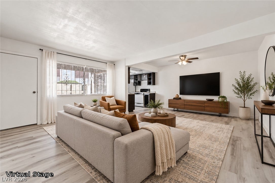1405 Vegas Valley Drive, #187, Las Vegas, NV 89169 Smooth wood-look flooring and an open layout connect the living area and kitchen seamlessly.