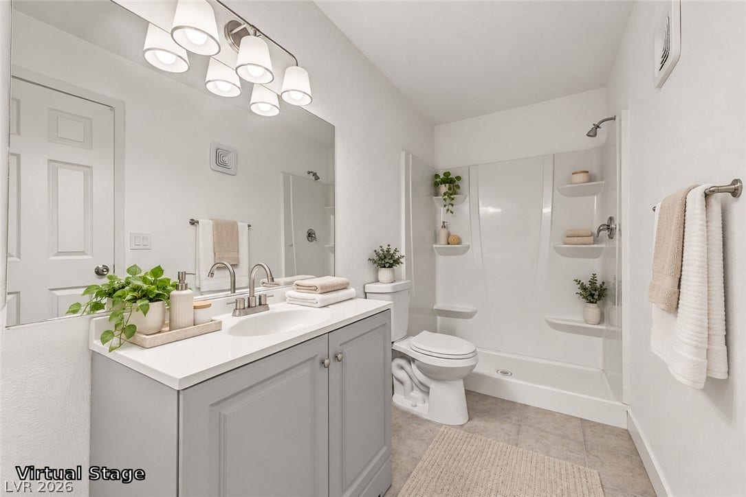 1405 Vegas Valley Drive, #187, Las Vegas, NV 89169 Clean lines and stone-look flooring define this contemporary bath space.