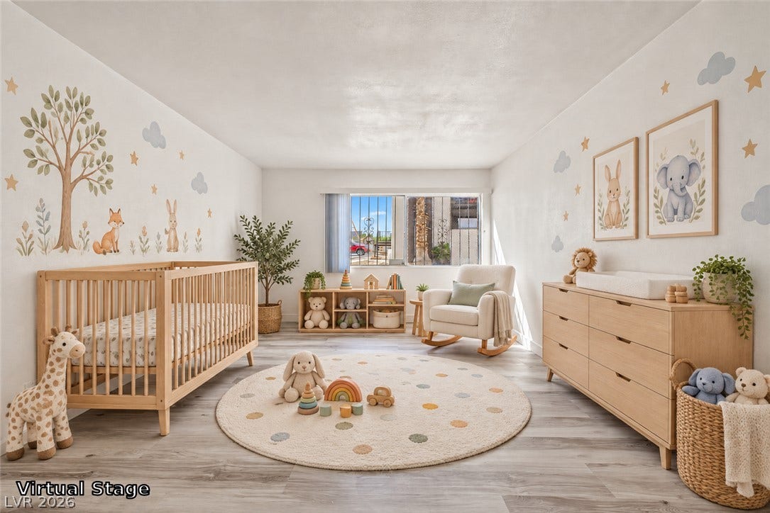 1405 Vegas Valley Drive, #187, Las Vegas, NV 89169 Smooth wood-look flooring and a wide window define this versatile secondary room.