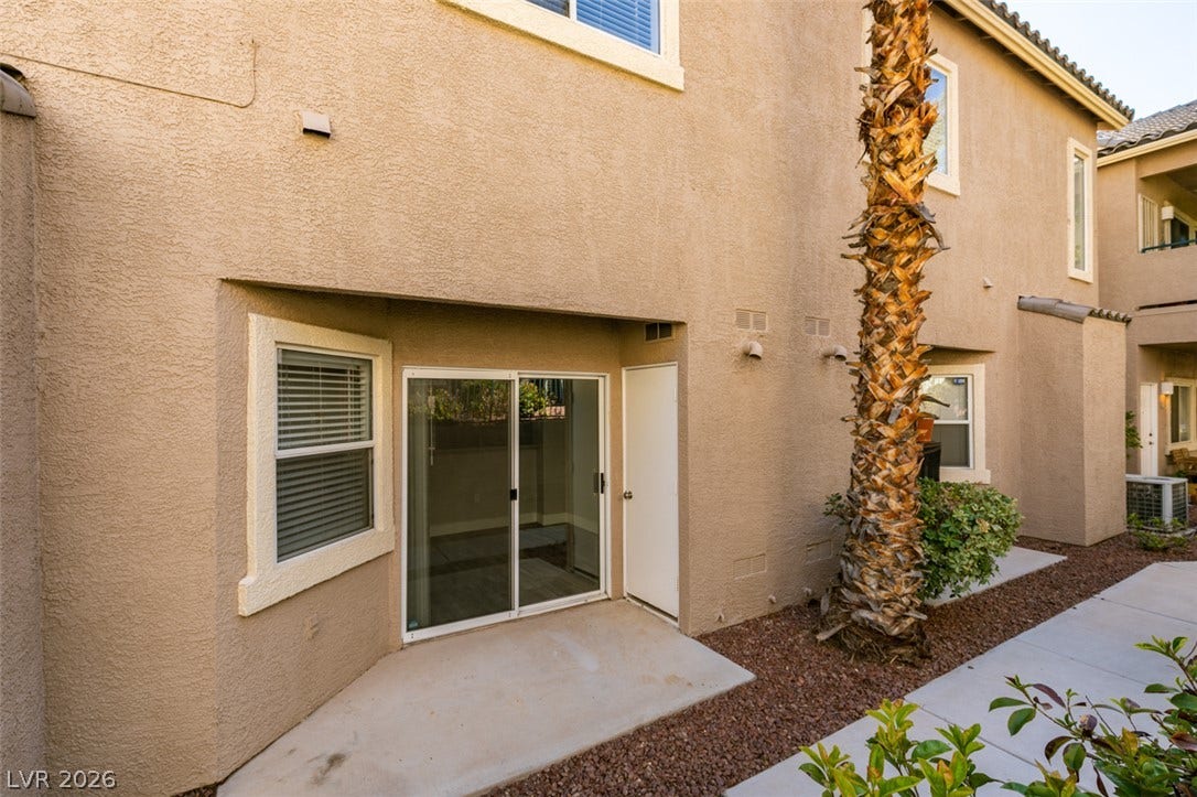 2001 Jade Creek Street, #105, Las Vegas, NV 89117 A covered concrete patio area offers direct access through sliding glass doors.