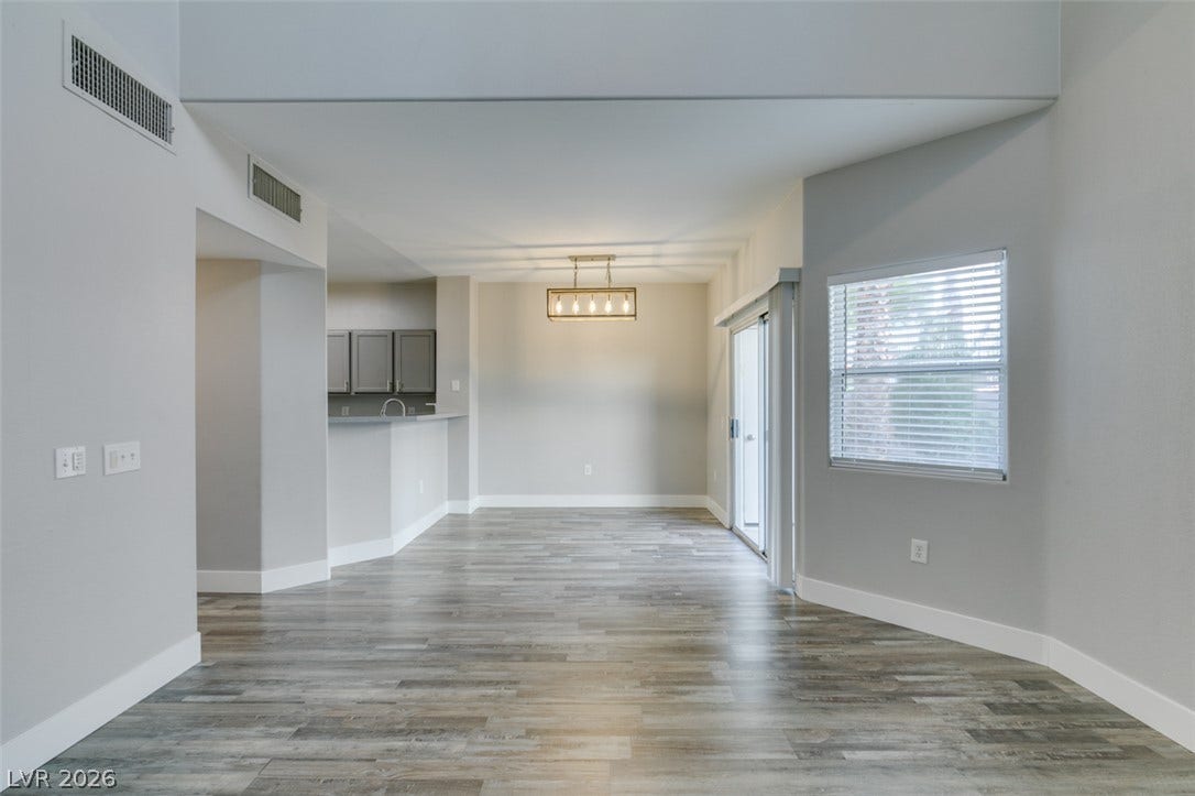 2001 Jade Creek Street, #105, Las Vegas, NV 89117 An open dining area flows seamlessly into the adjacent kitchen with durable wood-look flooring.