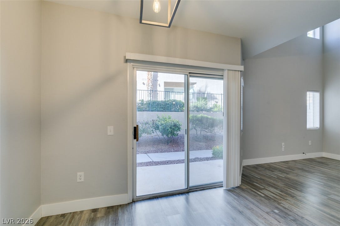 2001 Jade Creek Street, #105, Las Vegas, NV 89117 Sliding glass doors open directly to the outdoor patio and landscaped common area.