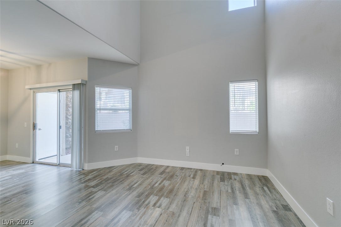 2001 Jade Creek Street, #105, Las Vegas, NV 89117 Towering ceilings and durable vinyl flooring define this versatile main living area.