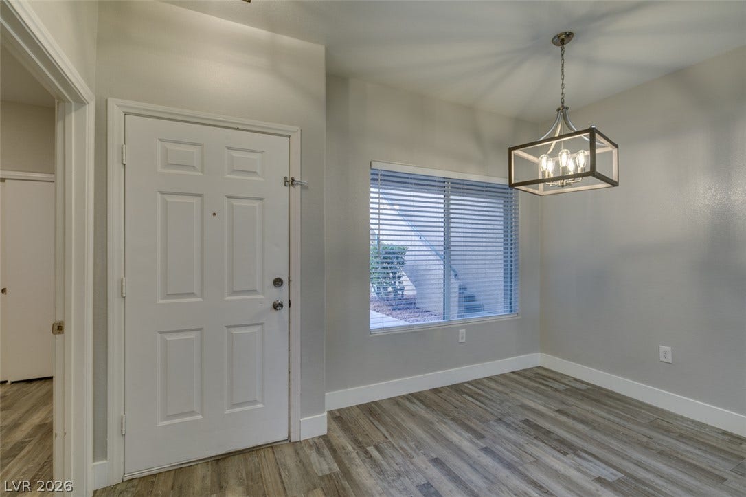 2001 Jade Creek Street, #105, Las Vegas, NV 89117 Gleaming wood-look floors and clean-lined architecture define this welcoming entry space.