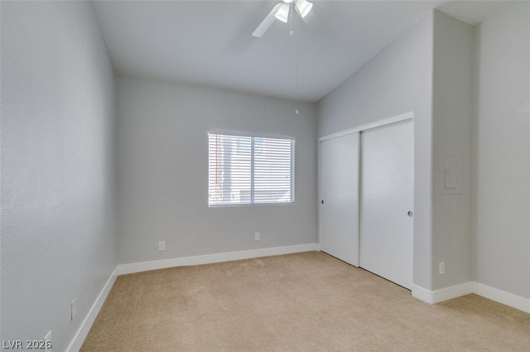 2001 Jade Creek Street, #105, Las Vegas, NV 89117 High vaulted ceilings and neutral carpeting define this comfortable secondary bedroom.