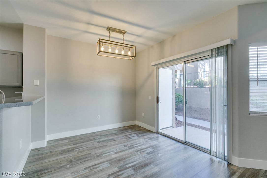 2001 Jade Creek Street, #105, Las Vegas, NV 89117 Sliding glass doors open directly to the outdoor patio from this versatile dining area.