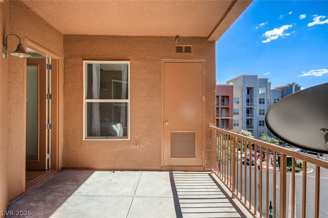 Private outdoor balcony overlooking the neighborhood.