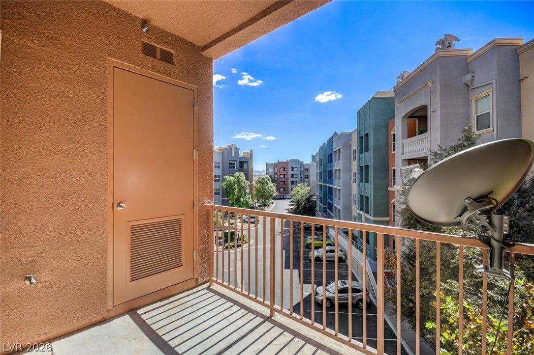 Take in neighborhood views from this private upper-level balcony.