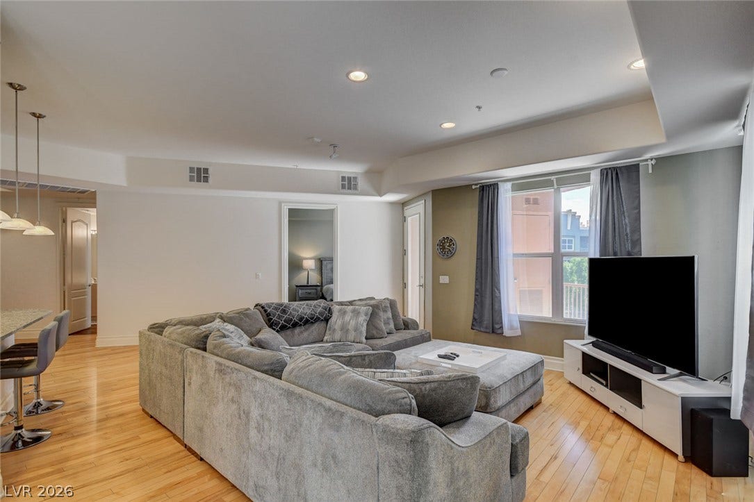 Tray ceilings define this welcoming open-concept living area.