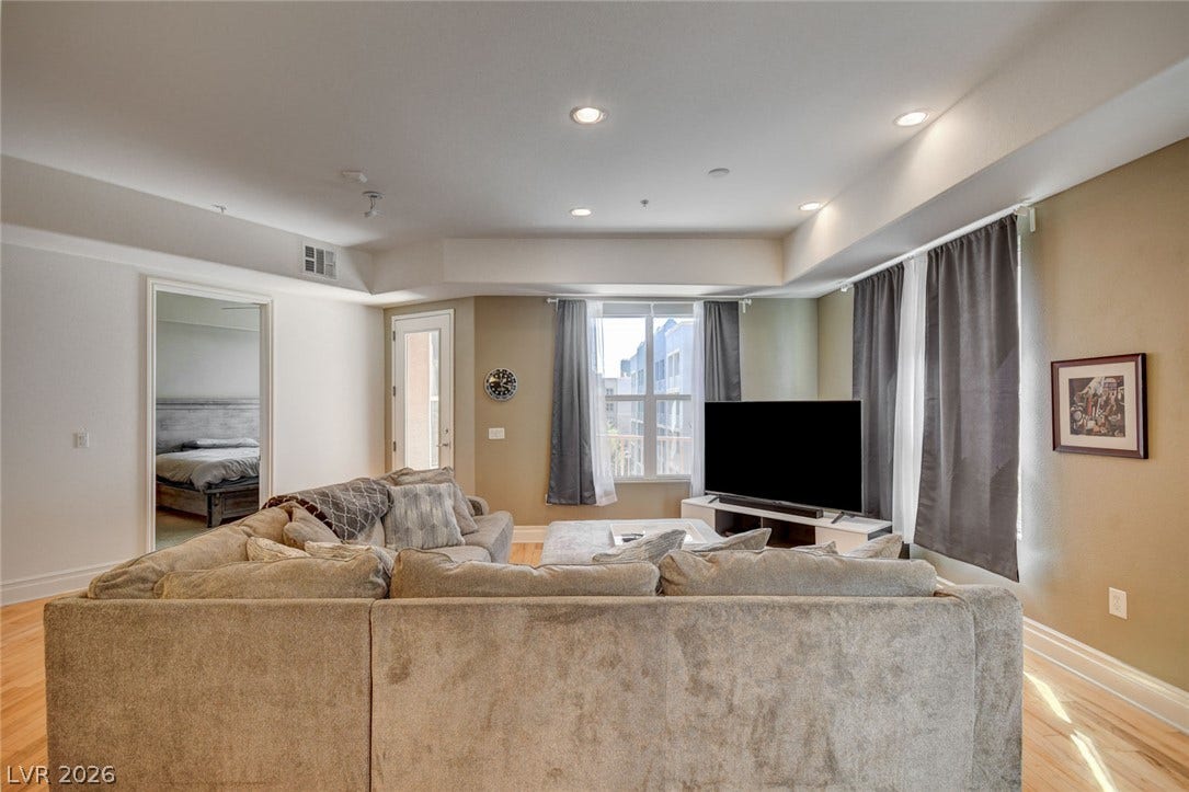 Modern recessed lighting define this welcoming open living space.