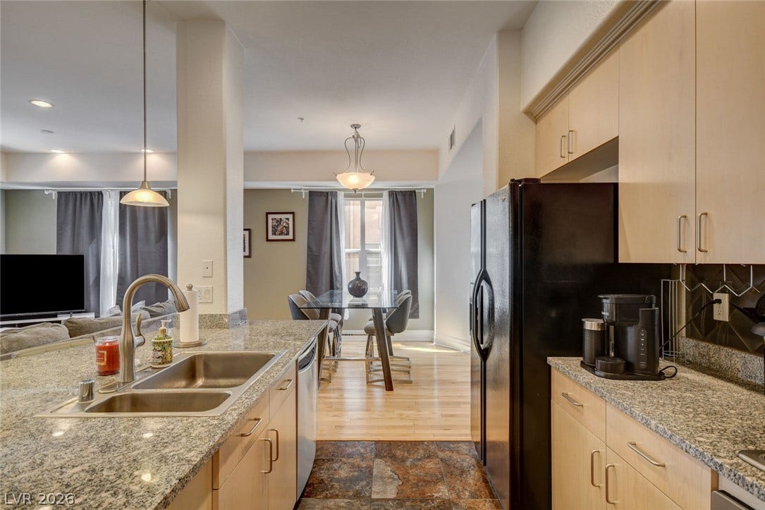 An open layout connects the kitchen to the dining and living areas seamlessly.