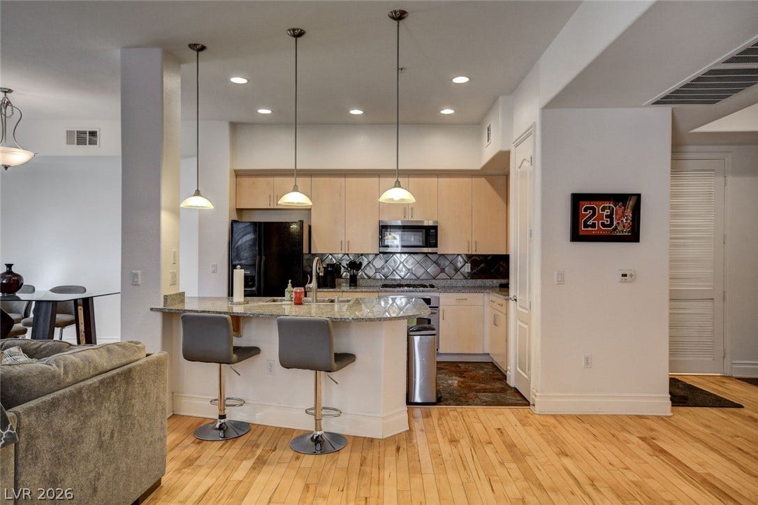 Open-concept kitchen featuring a convenient breakfast bar.
