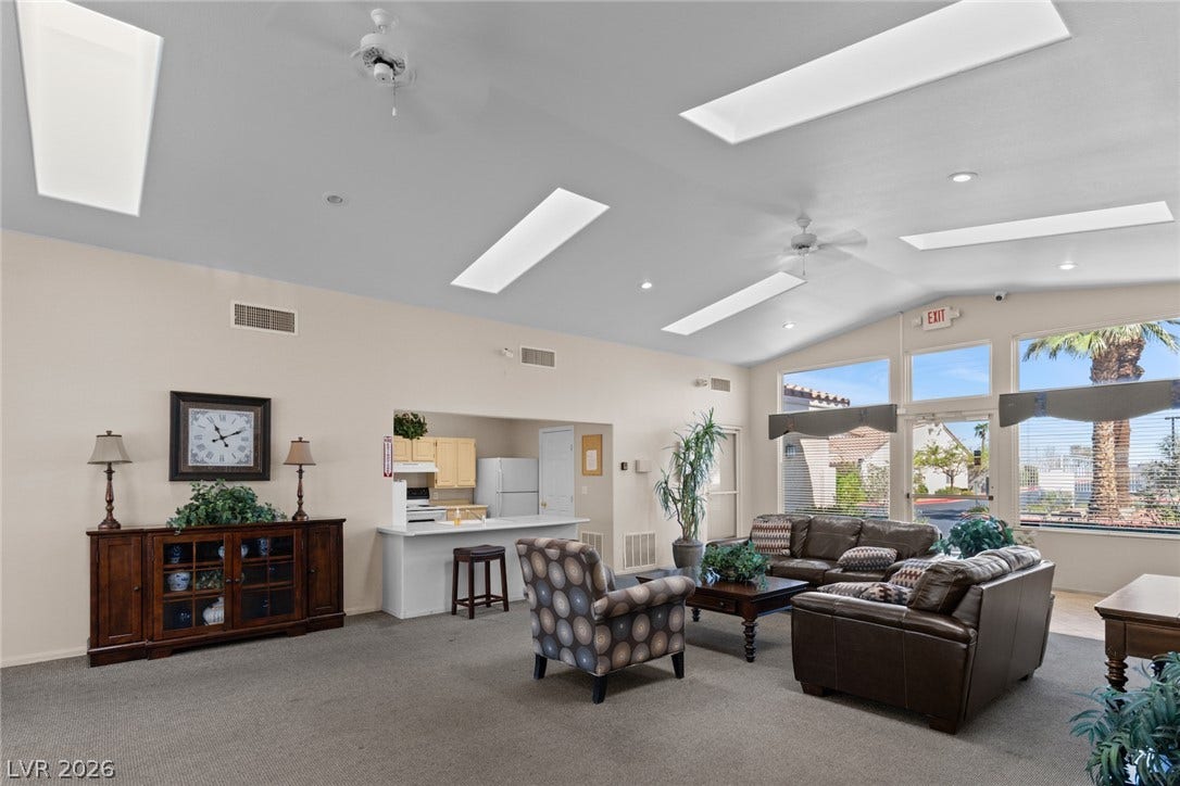 855 N Stephanie Street, #2615, Henderson, NV 89014 High vaulted ceilings with multiple skylights and towering windows illuminate the open living area.