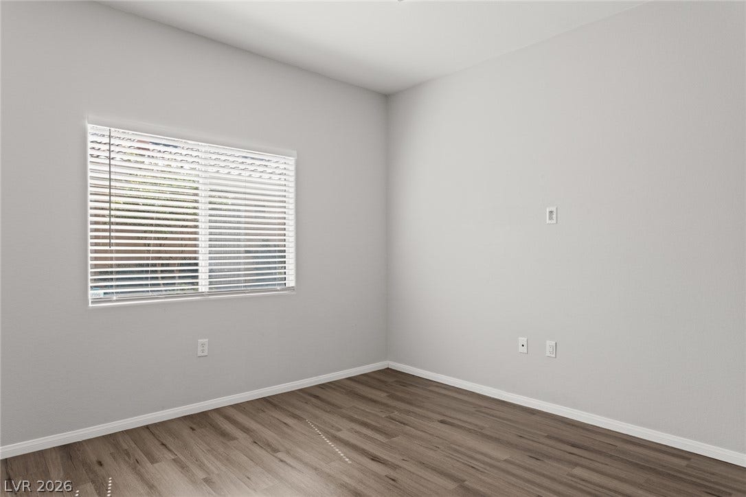 855 N Stephanie Street, #2615, Henderson, NV 89014 Smooth wood-style flooring and a wide window with blinds define this versatile room.